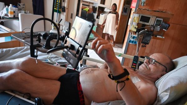 In this file photo taken on August 12, 2020 Alain Cocq, suffering from an orphan desease of the blood, rests on his medical bed in his flat in Dijon, northeastern France. Cocq announced on September 4, 2020 that he had been refused by the French President in his request to help him die and that he will cease all treatment from this day on. (AFP)