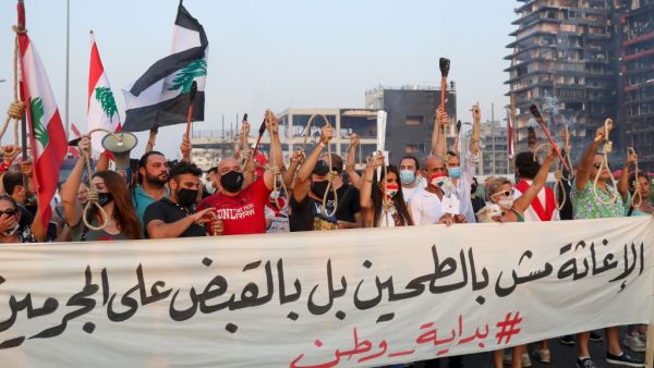 Lebanese demonstrators carry nooses during a demonstration to mark one month since the cataclysmic August 4 explosion that killed 191 people, at Beirut's port area in the Lebanese capital Beirut on September 4, 2020. ANWAR AMRO / AFP