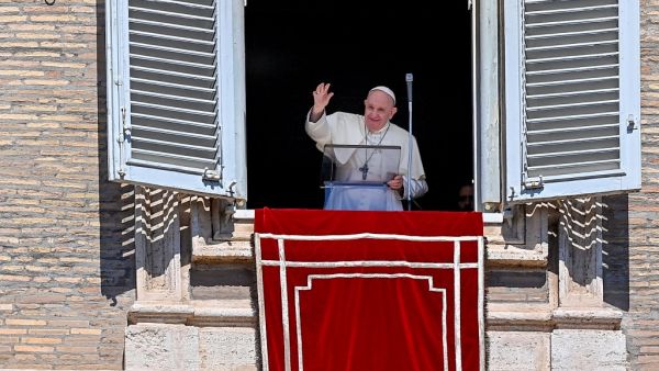Pope Francis waves to worshipers from the window of the apostolic palace overlooking St. Peter's Square on September 6, 2020 in The Vatican, during the weekly Angelus prayer within the COVID-19 infection, caused by the novel coronavirus. Vincenzo PINTO / AFP
