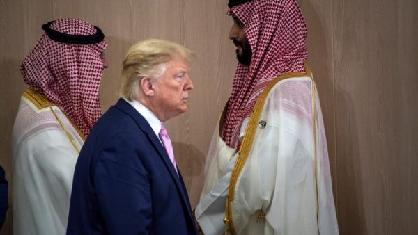 In this file photo US President Donald Trump and Saudi Arabia's Crown Prince Mohammed Bin Salman (R) arrive for a meeting on "World Economy" at the G20 Summit in Osaka on June 28, 2019. US President Donald Trump boasted that he saved Saudi Arabia's crown prince from greater scrutiny over the killing of journalist Jamal Khashoggi, according to an explosive new book. In one of 18 interviews with legendary investigative reporter Bob Woodward, Trump defended Mohammed bin Salman over the gruesome murder inside a