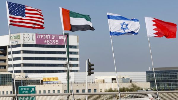 The flags of (L-R) the US, the United Arab Emirates, Israel and Bahrain are flown along a road, in the resort city of Netanya in central Israel, on September 13, 2020. The UAE and Bahrain will sign agreements to recognise Israel, on September 15. US President Donald Trump and Israeli Prime Minister Benjamin Netanyahu are to sign the Abraham accords -- a reference to the common traditions of Islam, Judaism and Christianity -- at a White House ceremony. JACK GUEZ / AFP