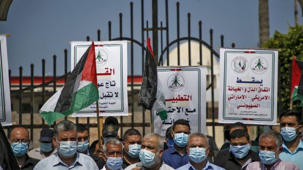 Demonstrators, mask-clad due to the COVID-19 coronavirus pandemic, attend a protest against the United Arab Emirates' and Bahrain's decisions to normalise relations with Israel, in Gaza City on September 15, 2020. Mohammed ABED / AFP