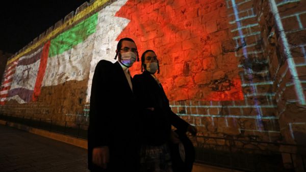 The flags of US, Israel, United Arab Emirates, and Bahrain are projected on the ramparts of Jerusalem's Old City on September 15, 2020 in a show of support for Israeli normalisation deals with the United Arab Emirates and Bahrain. The decision by the UAE and Bahrain to normalise ties with Israel breaks with decades of consensus within the Arab world that a peace deal with the Palestinians is a prerequisite for establishing relations with the Jewish state. menahem kahana / AFP