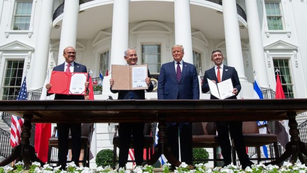 (L-R)Bahrain Foreign Minister Abdullatif al-Zayani, Israeli Prime Minister Benjamin Netanyahu, US President Donald Trump, and UAE Foreign Minister Abdullah bin Zayed Al-Nahyan hold up documents after participating in the signing of the Abraham Accords where the countries of Bahrain and the United Arab Emirates recognize Israel, at the White House in Washington, DC, September 15, 2020. Israeli Prime Minister Benjamin Netanyahu and the foreign ministers of Bahrain and the United Arab Emirates arrived Septembe