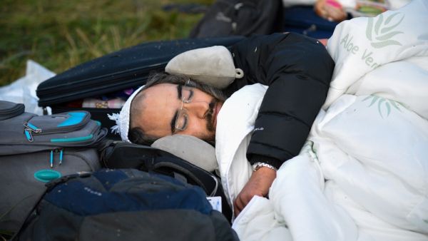 This picture taken on September 16, 2020 shows Jewish pilgrims stuck between Belarusian and Ukrainian border crossings. Hundreds of Hasidic Jews were still massed at Ukraine's border, with some saying they had no intention of leaving, even though Kiev has refused their entry citing coronavirus and Israel has urged them to return. Tens of thousands of Hasidic Jews head to the central Ukrainian city of Uman every Jewish New Year -- which falls on September 18-20 this year -- to visit the tomb of Rabbi Nahman,
