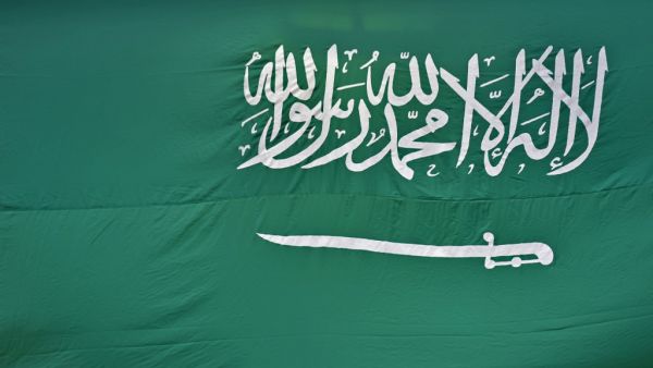 A picture taken on September 23, 2020 shows a Saudi national flag in the capital Riyadh. FAYEZ NURELDINE / AFP
