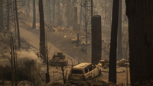 A community of forest homes lies in ruins along Auberry Road in the Meadow Lakes area after the Creek Fire swept through on September 8, 2020 near Shaver Lake, California. (AFP)