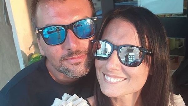 Paola Agnelli and Michele D'Alpaos met from their balconies during lockdown in Verona, Italy. (Instagram)