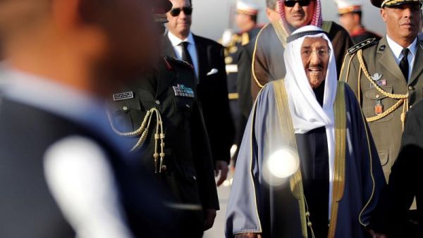 A 2019 file picture shows Kuwait’s Emir Sheikh Sabah Al-Ahmad Al- Jaber Al-Sabah reviewing an honour guard upon his arrival in Tunis to attend the Arab Summit. (AFP)