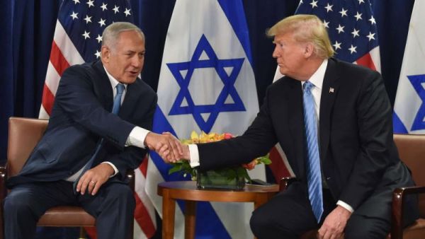US President Donald Trump shakes hands with Israeli Prime Minister Binyamin Netanyahu. (AFP)