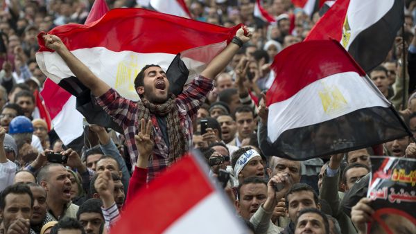 Egyptian anti-goverment demonstrators wave Egyptian flags at Cairo's Tahrir Square on February 10, 2011 on the 17th day of protests against President Hosni Mubarak's regime. (AFP/File)