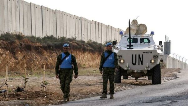 United Nations Interim Force in Lebanon (UNIFIL) soldiers patrol along the border wall with Israel near the southern Lebanese village of Kfar Kila on December 4, 2018. (Mahmoud Zayyat/AFP)