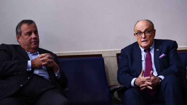 Former New Jersey Governor Chris Christie (L) and former New York City Mayor Rudy Giuliani (R) talk before a briefing at the White House September 27, 2020, in Washington, DC. US President Donald Trump paid just $750 in federal income taxes in 2016, the year he won the election, The New York Times reported September 27, 2020, citing tax return data extending more than 20 years. Brendan Smialowski / AFP