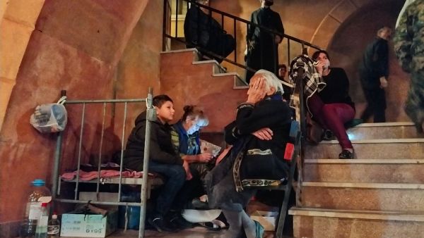 People shelter in the basement of the main church of the breakaway Nagorno-Karabakh region's main city of Stepanakert on October 4, 2020, during the ongoing fighting between Armenia and Azerbaijan over the disputed region. AFP