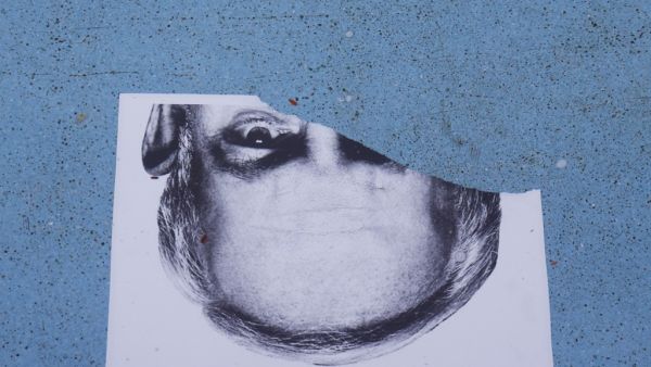 A torn poster depicting Israeli Prime Minister Benjamin Netanyahu lies on the ground during an anti-government demonstration despite the renewal of emergency restrictions in the Israeli coastal city of Tel Aviv on October 8, 2020. JACK GUEZ / AFP