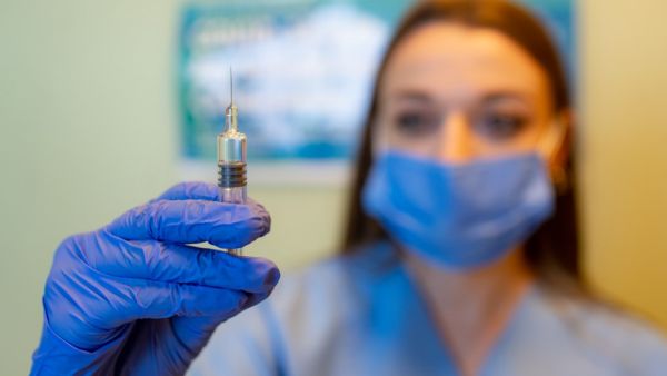 A health worker administers a dose of Sinovac Biotech potential vaccine against the COVID-19 during the 3rd phase trials at the Acibadem Hospital in Istanbul, on October 9, 2020.Y Yasin AKGUL / AFP