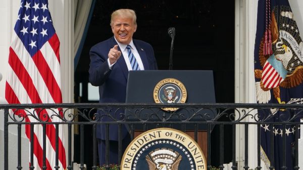 US President Donald Trump greets supporters after speaking about law and order from the South Portico of the White House in Washington, DC, on October 10, 2020. Trump spoke publicly for the first time since testing positive for Covid-19, as he prepares a rapid return to the campaign trail just three weeks before the election. MANDEL NGAN / AFP
