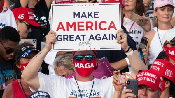 Supporters of US President Donald Trump attend a Make America Great Again rally as he campaigns at Orlando Sanford International Airport in Sanford, Florida, October 12, 2020. SAUL LOEB / AFP