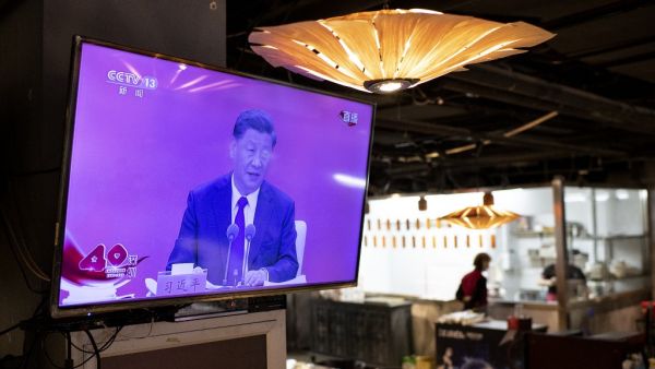 A television screen at a restaurant in Beijing shows Chinese President Xi Jinping speaking during a broadcast from Shenzhen at an event marking the 40th anniversary of the establishment of the Shenzhen Special Economic Zone, on October 14, 2020. on October 14, 2020.  NOEL CELIS / AFP