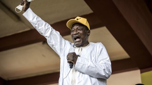Current President and presidential candidate, Alpha Conde addresses his supporters at a campaign rally in Conakry on October 16, 2020. The President is bidding for a third term in office with the presidential elections to be held on October 18, defying critics who say he forced through a new constitution this year enabling him to sidestep two-term presidential limits. JOHN WESSELS / AFP