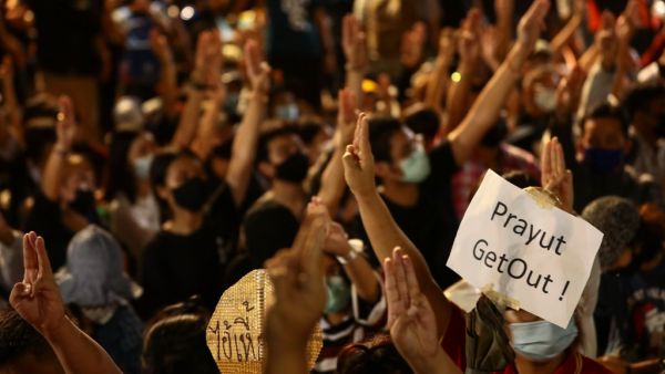 A sign directed at Thailand's Prime Minister Prayut Chan-O-Cha is held up by a pro-democracy protester during an anti-government rally on the ouskirts of Bangkok on October 19, 2020. Jack TAYLOR / AFP A sign directed at Thailand's Prime Minister Prayut Chan-O-Cha is held up by a pro-democracy protester during an anti-government rally on the ouskirts of Bangkok on October 19, 2020. Jack TAYLOR / AFP