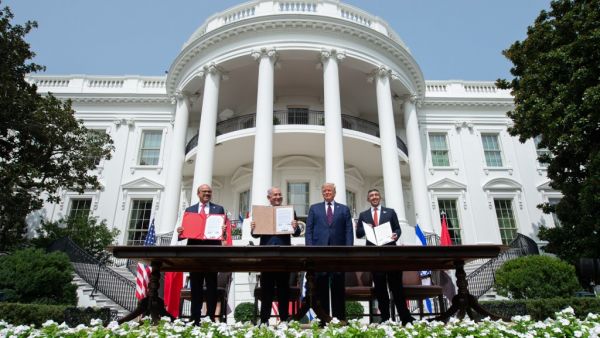 (L-R) Bahraini Foreign Minister Abdullatif al-Zayani, Israeli Prime Minister Benjamin Netanyahu, US President Donald Trump, and UAE Foreign Minister Abdullah bin Zayed Al-Nahyan hold up documents after participating in the signing of the Abraham Accords where the countries of Bahrain and the United Arab Emirates recognize Israel, at the White House in Washington, DC. (AFP)