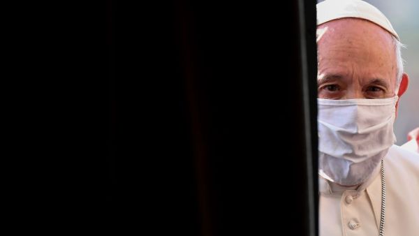 Pope Francis, wearing a protective face mask, arrives for an inter-religious prayer service for peace along with other religious representatives in the Basilica of Santa Maria in Aracoeli, a church on top of Rome's Capitoline Hill, on October 20, 2020 in Rome. Andreas SOLARO / AFP