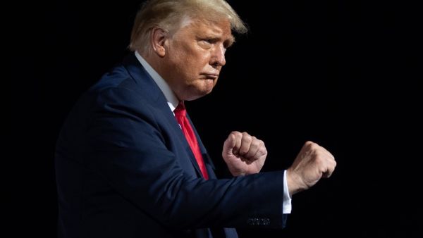 US President Donald Trump dances at the end of a Make America Great Again rally as he campaigns in Gastonia, North Carolina, October 21, 2020. SAUL LOEB / AFP