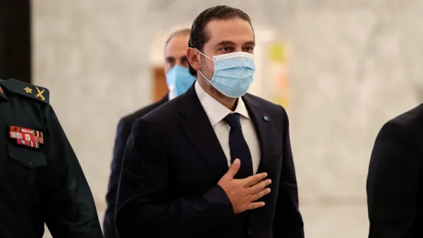 Former Lebanese prime minister Saad Hariri (C) arrives at the office of President Michel Aoun, after the latter appointed him to form a new cabinet, at the presidential palace in Baabda, east of the capital Beirut, on October 22, 2020. Aoun today named former premier Saad Hariri to form a new cabinet to lift the country out of crisis after most parliamentary blocs backed his nomination. Hariri, who has previously led three governments in Lebanon, stepped down almost a year ago under pressure from unpreceden