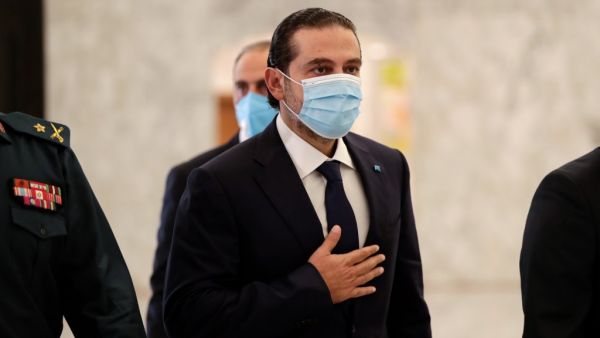 Former Lebanese prime minister Saad Hariri (C) arrives at the office of President Michel Aoun, after the latter appointed him to form a new cabinet, at the presidential palace in Baabda, east of the capital Beirut, on October 22, 2020. Aoun today named former premier Saad Hariri to form a new cabinet to lift the country out of crisis after most parliamentary blocs backed his nomination. Hariri, who has previously led three governments in Lebanon, stepped down almost a year ago under pressure from unpreceden