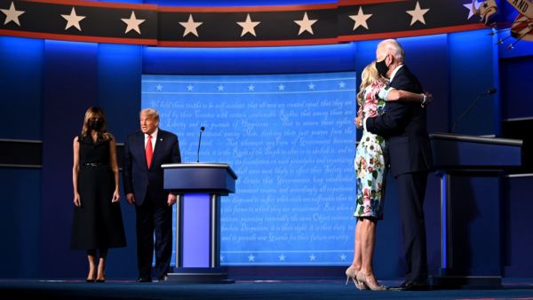 US First Lady Melania Trump (L) stands with US President Donald Trump as Jill Biden (R) hugs husband Democratic Presidential candidate and former US Vice President Joe Biden after the conclusion of the final presidential debate at Belmont University in Nashville, Tennessee, on October 22, 2020. Jim WATSON / AFP