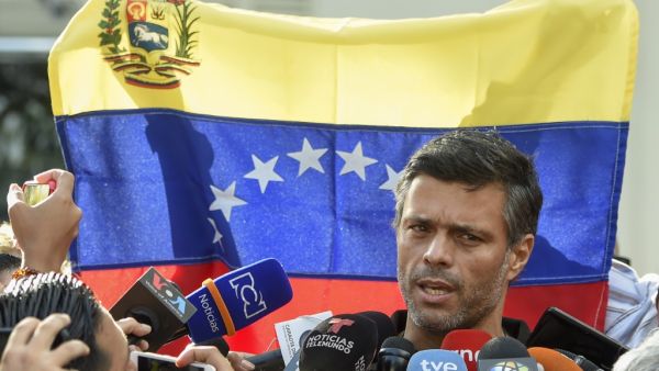 In this file photo taken on May 02, 2019, Venezuelan high-profile opposition politician Leopoldo Lopez speaks outside the Spanish embassy in Caracas, where he sought refuge since claiming to have been freed from house arrest two days ago by rebel military personnel. Juan BARRETO / AFP