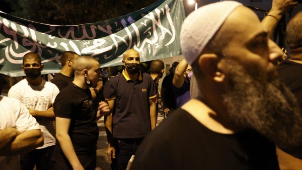 Arab-Israeli protesters gather outside the residence of the French Ambassador to Israel, in Tel Aviv on October 24, 2020, in response to comments by French President Emmanuel Macron defending cartoons of the Prophet Mohammed. JACK GUEZ / AFP