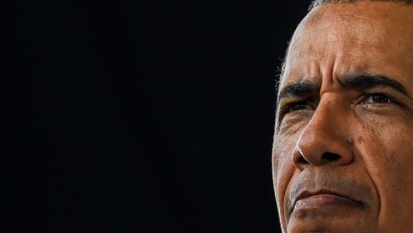 Former US President Barack Obama speaks at a Biden-Harris drive-in rally in Miami, Florida on October 24, 2020. CHANDAN KHANNA / AFP
