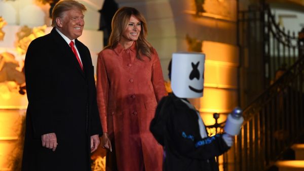 US President Donald Trump and First Lady Melania Trump greet trick or treaters during a Halloween celebration at the White House in Washington, DC, on October 25, 2020. (AFP)