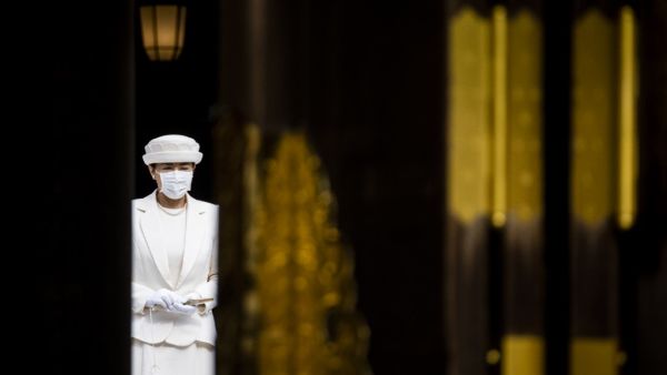 Japan's Empress Masako wearing a face mask leaves the main shrine after paying a tribute during a ceremony to mark 100 years since the founding of Meiji shrine in Tokyo on October 28, 2020. Behrouz MEHRI / AFP