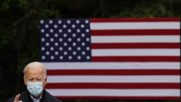 Democratic presidential nominee Joe Biden delivers remarks in the parking lot of the United Food and Commercial Workers International Union Local 951 while campaigning October 02, 2020 in Grand Rapids, Michigan. Biden said he tested negative twice Friday for the coronavirus after it was reported that U.S. President Donald Trump and first lady Melania Trump tested positive for COVID-19. Chip Somodevilla/Getty Images/AFP CHIP SOMODEVILLA / GETTY IMAGES NORTH AMERICA / Getty Images via AFP