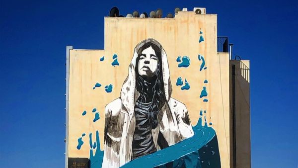 By Suhaib Attar, Girl in blue. Part of @baladk project 2020 session mural is about waste control and to keep our water and sea clean (Instagram)