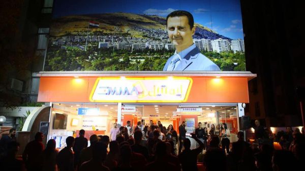 Shoppers crowded outside an Emmatel store in an upmarket district of Damascus. (Courtesy Emmatel)