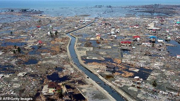 The number of natural disasters around the world has doubled since the turn of the century. Pictured: the after-effects of the tsunami in Indonesia on Boxing Day, 2004./ (AFP/File)