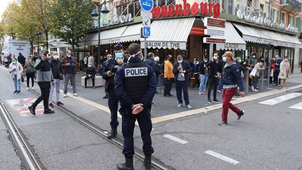 French policemen stand guard a street after a knife attack in Nice. (AFP)