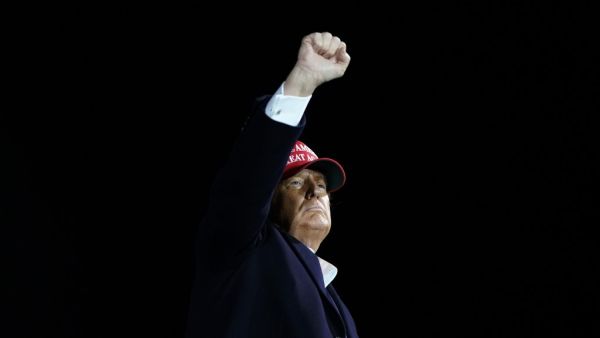 US President Donald Trump pumps his fist as he hosts a Make America Great Again campaign event at Des Moines International Airport in Des Moines, Iowa on October 14, 2020. Alex Edelman / AFP