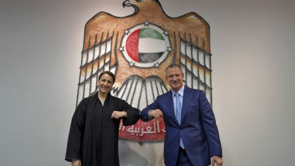 In this file photo taken on October 27, 2020, Emirati Minister of State for Food and Water Security Mariam al-Muhairi (L) and Erel Margalit, founder and chairman of Jerusalem Venture Partners (JVP), greet each other with an elbow bump at the headquarters of the Government Accelerators in Dubai. Karim SAHIB / AFP