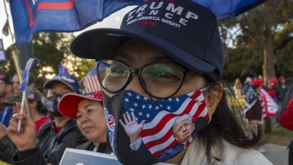 Supporters of US President Donald Trump rally after Democratic nominee Joe Biden won the 2020 presidential election, in Beverly Hills, California, on November 7, 2020. Democrat Joe Biden urged unity on November 7 and promised "a new day for America" in his first national address since he won the tense US election and ended the historically turbulent and divisive era of Donald Trump. DAVID MCNEW / AFP