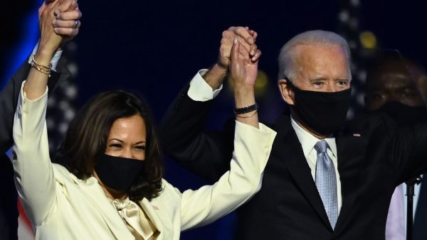 US President-elect Joe Biden and Vice President-elect Kamala Harris stand onstage after delivering remarks in Wilmington, Delaware, on November 7, 2020, after being declared the winners of the presidential election. Jim WATSON / AFP