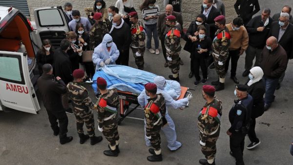 The body of Palestine Liberation Organisation secretary general and chief negotiator Saeb Erekat arrives at a hospital in the West Bank city of Ramallah on November 10, 2020. (AFP/File)