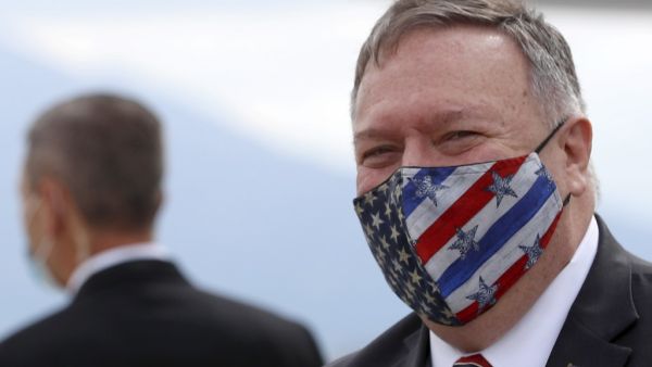 In this file photo taken on October 02, 2020 US Secretary of State Mike Pompeo wears a face mask as he arrives at the airport in Dubrovnik as part of his six-day trip to Southern Europe. Secretary of State Mike Pompeo on November 10, 2020 promised the world a "smooth transition" after US elections but refused to recognize President-elect Joe Biden's victory, saying Donald Trump will remain in power. Darko Bandic / POOL / AFP