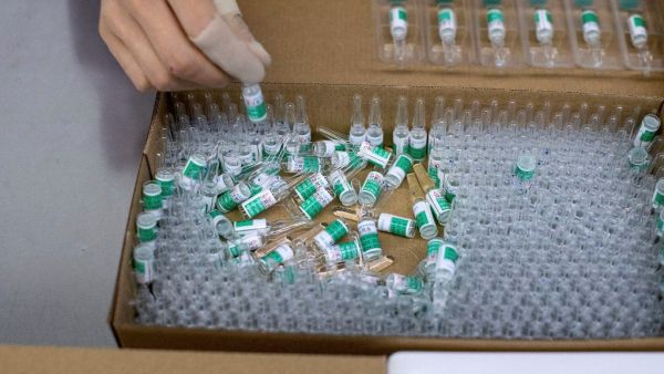 This file photo taken on June 9, 2020 shows a worker packaging rabies vaccine at a lab at the Yisheng Biopharma company, where researchers are trying to develop a vaccine for the Covid-19 coronavirus, in Shenyang, in China's northeast Liaoning province. Noel CELIS / AFP