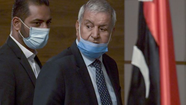 The chairman of the Libyan political accord committee, member of the High Council of State Bachir El Haouch (R), and the member of the founding committee of the Libyan constitution Abdelmonem El Sherif, arrive to hold a press conference on the UN-led Libyan talks, in the Tunisian capital Tunis, on November 14, 2020. FETHI BELAID / AFP