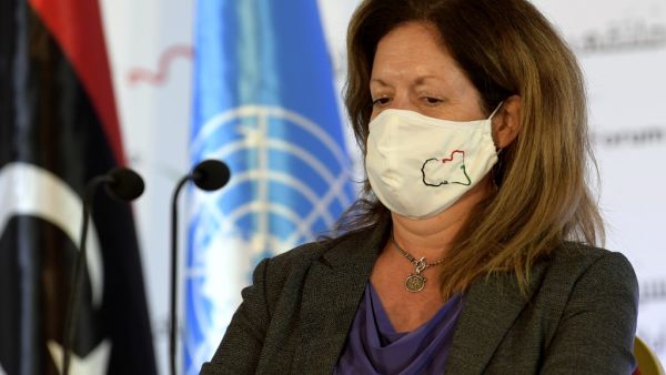 UN acting envoy to Libya Stephanie Williams wears a facemask as she arrives to speak during a press conference in the Tunisian capital Tunis on November 15, 2020, following seven days of talks, hosted by the UN on the Libyan conflict. The delegates "reached a preliminary roadmap for ending the transitional period and organising free, fair, inclusive and credible presidential and parliamentary elections," Williams told journalists. After years of conflict sparked by a 2011 NATO-backed uprising, Libya has two